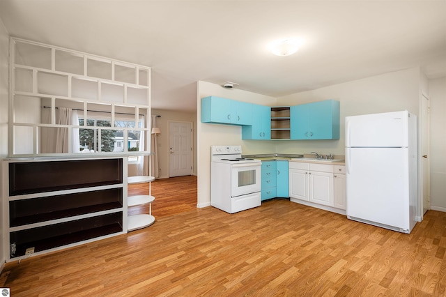 kitchen with white appliances, blue cabinetry, light wood finished floors, and open shelves