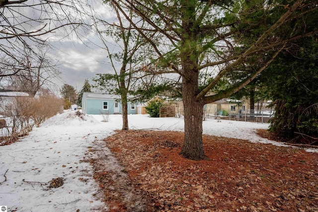 view of yard layered in snow