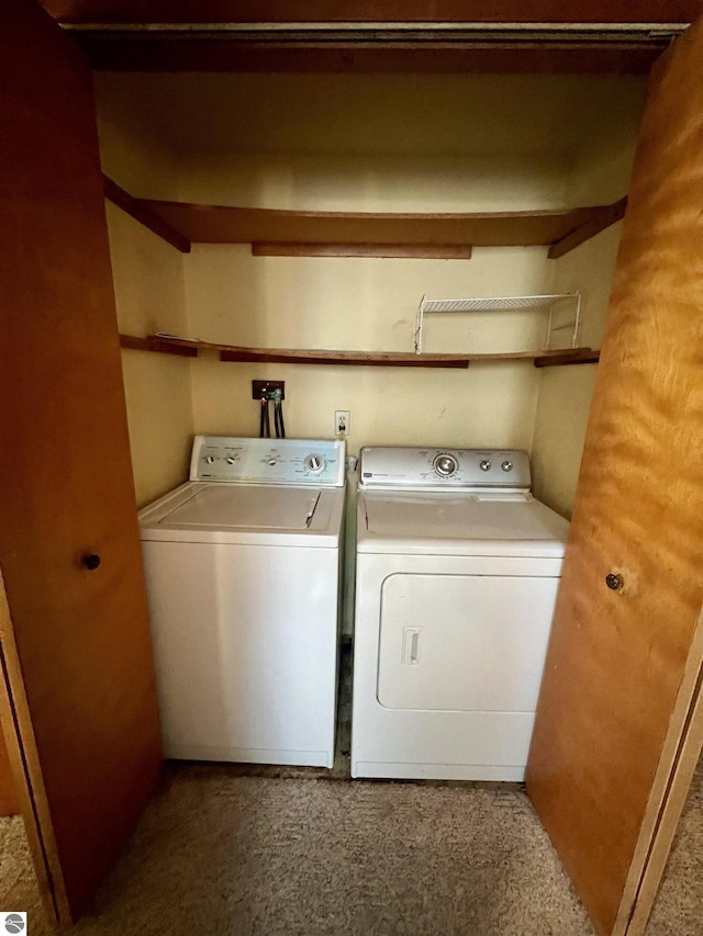 washroom featuring washer and dryer and laundry area