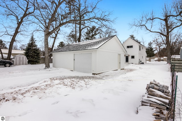 exterior space featuring an outbuilding and a garage