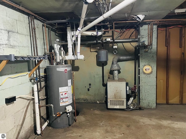 utility room featuring water heater and a heating unit