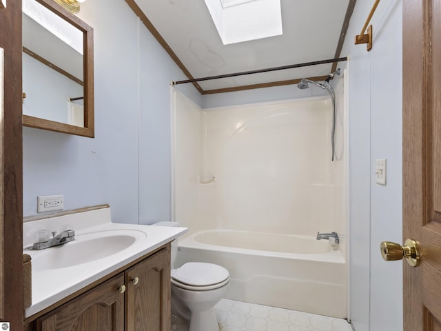 full bathroom with tub / shower combination, lofted ceiling with skylight, toilet, tile patterned floors, and vanity