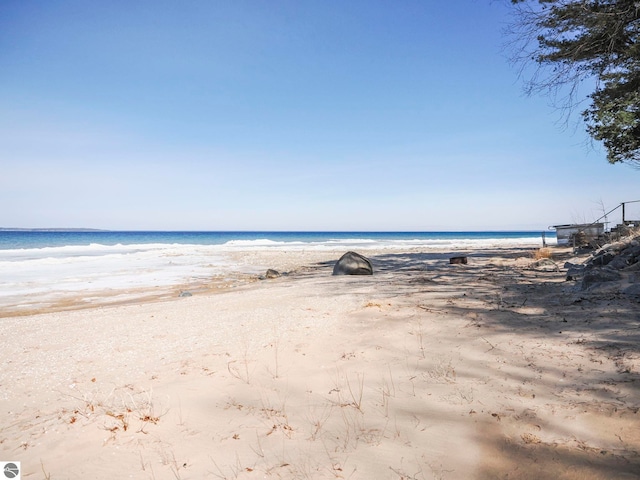 property view of water featuring a beach view