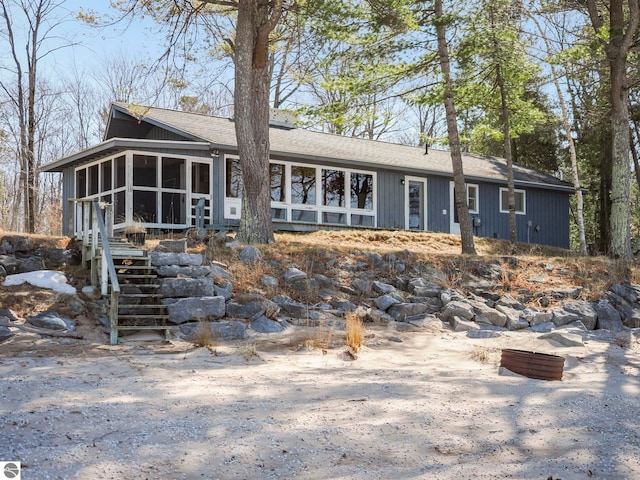 view of front of home featuring a sunroom