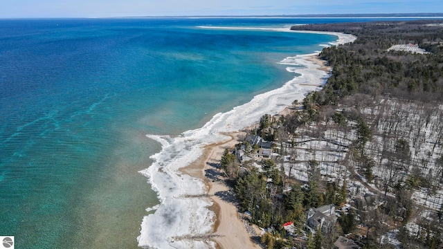 drone / aerial view featuring a view of the beach and a water view