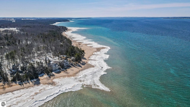 drone / aerial view with a beach view and a water view