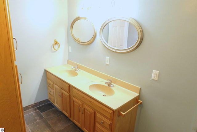 bathroom with double vanity and a sink