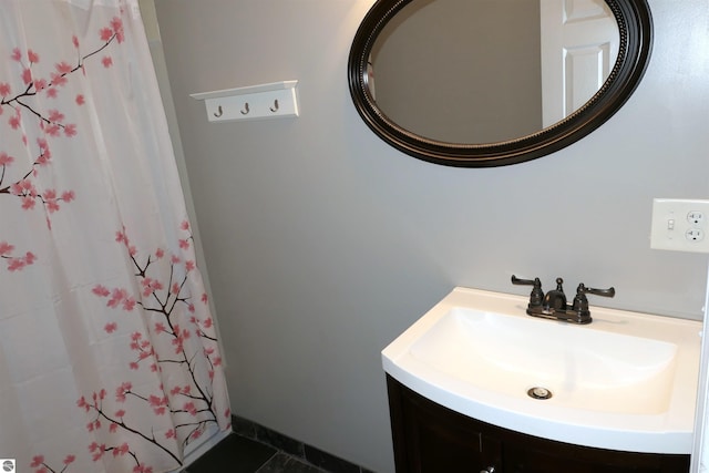 full bathroom with a shower with curtain and vanity