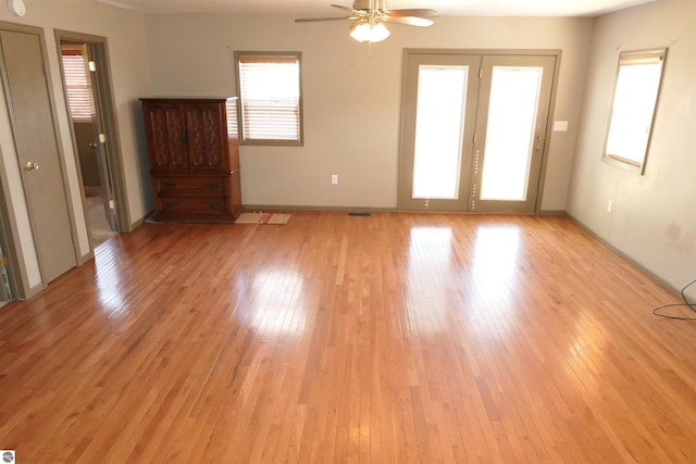 spare room featuring ceiling fan and light wood-style flooring