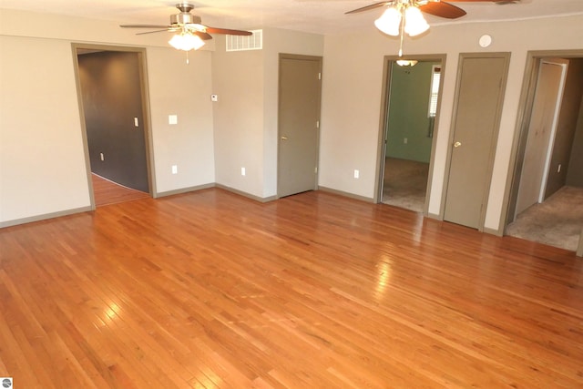 interior space featuring visible vents, light wood finished floors, and ceiling fan