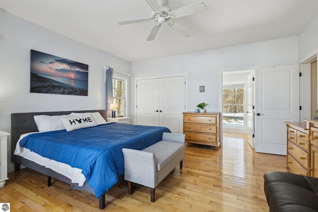 bedroom featuring a closet, ceiling fan, and light wood finished floors