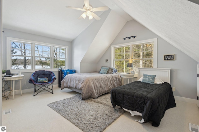 bedroom with visible vents, lofted ceiling, carpet, and baseboards