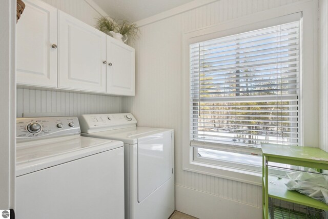 laundry room with cabinet space and independent washer and dryer