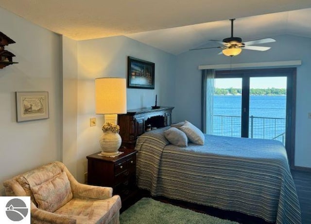 bedroom featuring access to exterior, ceiling fan, lofted ceiling, and a water view