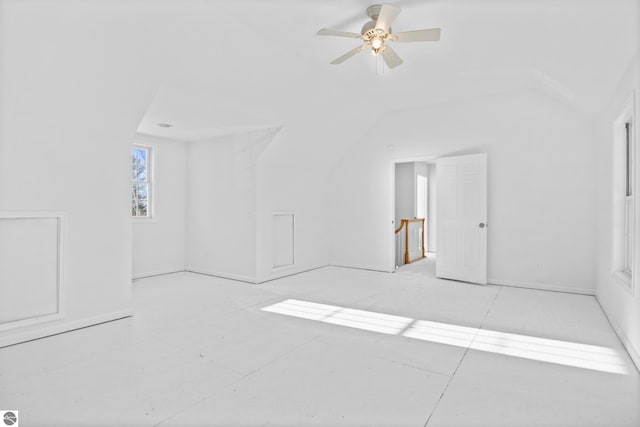 spare room with ceiling fan and vaulted ceiling