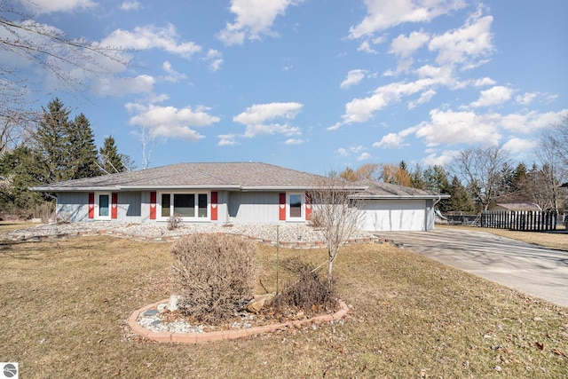 ranch-style home featuring driveway, a front yard, and fence