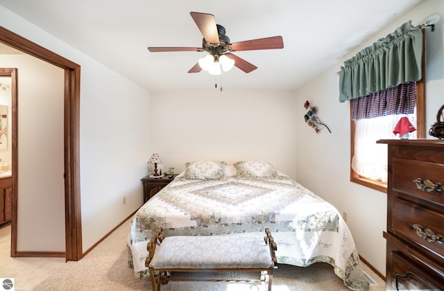 bedroom featuring baseboards and ceiling fan