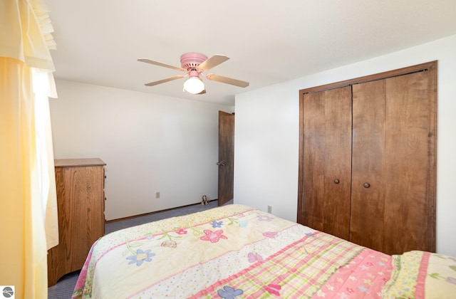 bedroom with a closet, baseboards, and ceiling fan