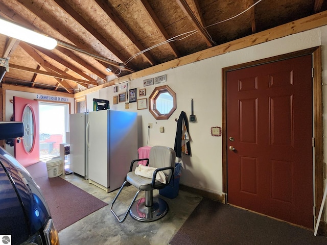 garage with freestanding refrigerator