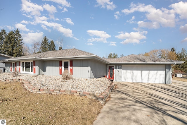 ranch-style house with a garage and driveway