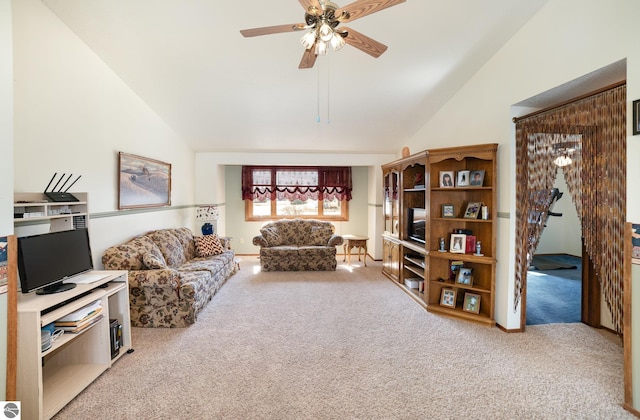 carpeted living area featuring lofted ceiling and a ceiling fan