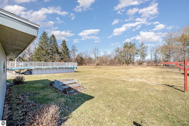 view of yard with an outdoor pool