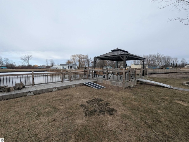 view of yard featuring a gazebo and a water view