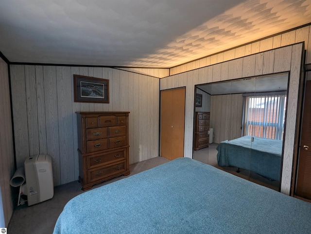 bedroom with wooden walls and crown molding