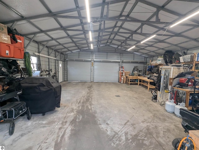 garage featuring metal wall and a workshop area