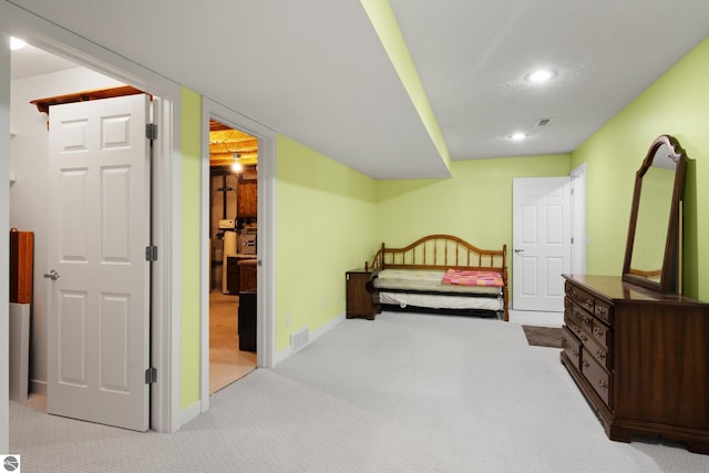 carpeted bedroom featuring recessed lighting, visible vents, and baseboards