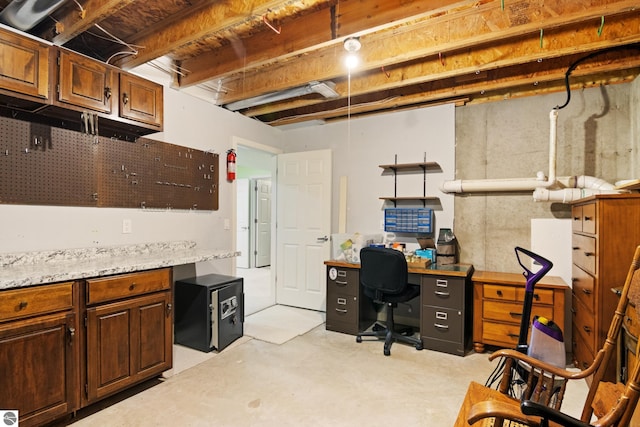 office area featuring concrete floors