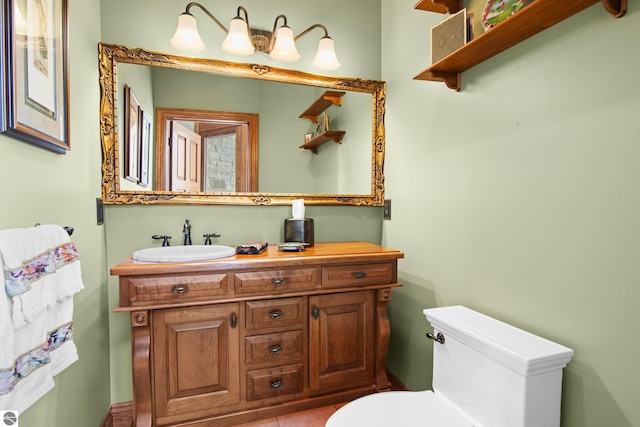 half bathroom featuring toilet and vanity