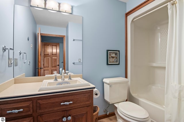 bathroom with shower / tub combo with curtain, toilet, and vanity