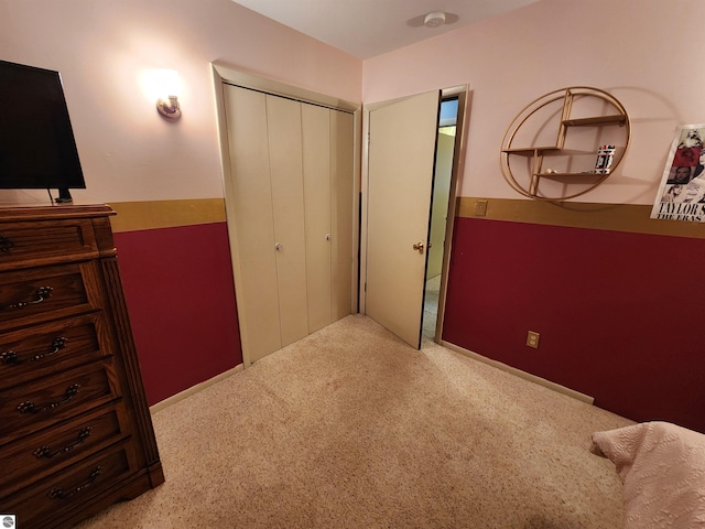 carpeted bedroom with a closet