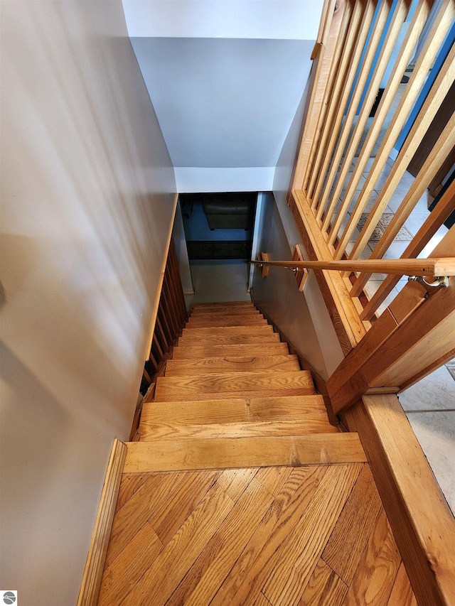 staircase featuring wood finished floors