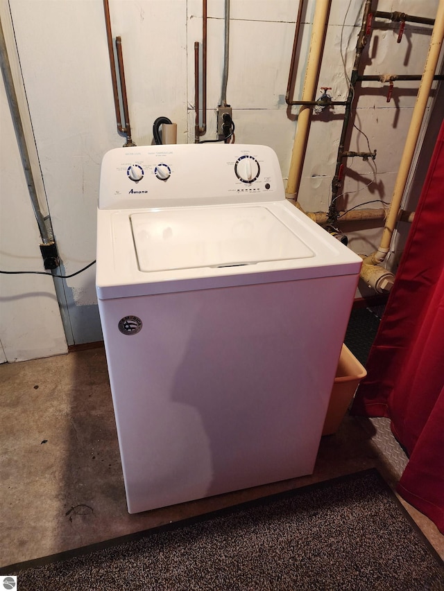 clothes washing area featuring laundry area and washer / clothes dryer