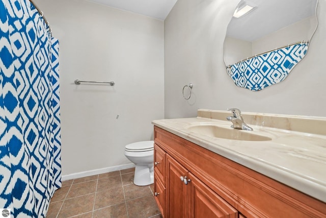 bathroom with vanity, a shower with shower curtain, baseboards, tile patterned flooring, and toilet