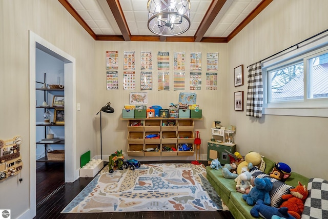 playroom featuring a notable chandelier, beamed ceiling, baseboards, and wood finished floors