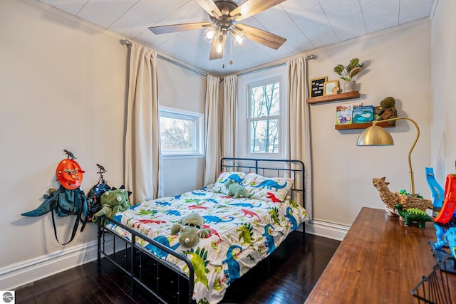 bedroom featuring a ceiling fan, dark wood-style floors, and baseboards