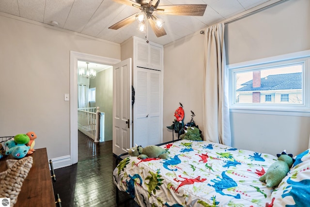 bedroom with a closet, wood finished floors, and a ceiling fan