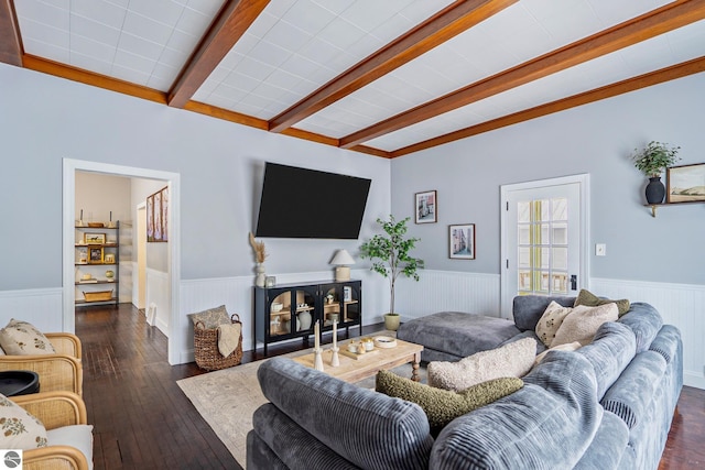 living room featuring beam ceiling, wainscoting, and hardwood / wood-style flooring