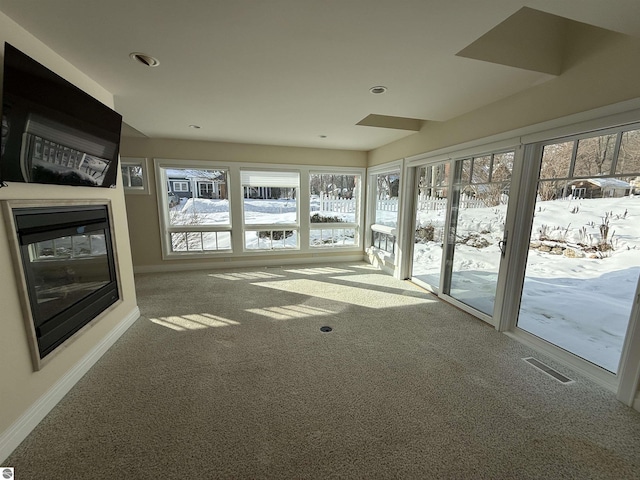 unfurnished sunroom featuring visible vents