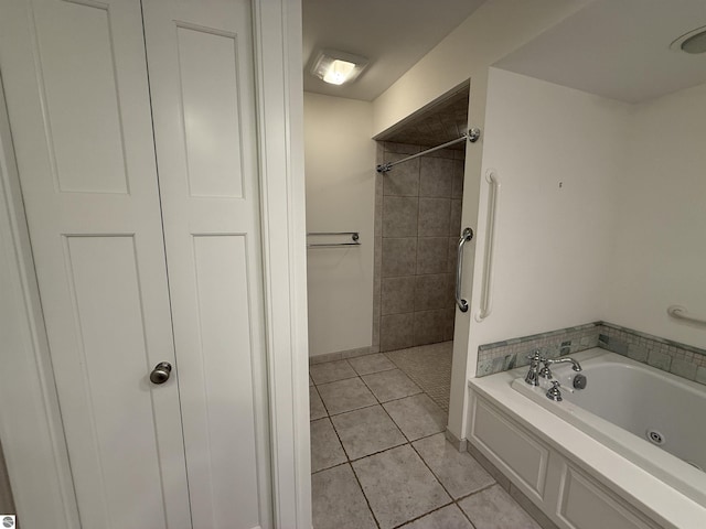 full bath with baseboards, tiled shower, a whirlpool tub, and tile patterned flooring