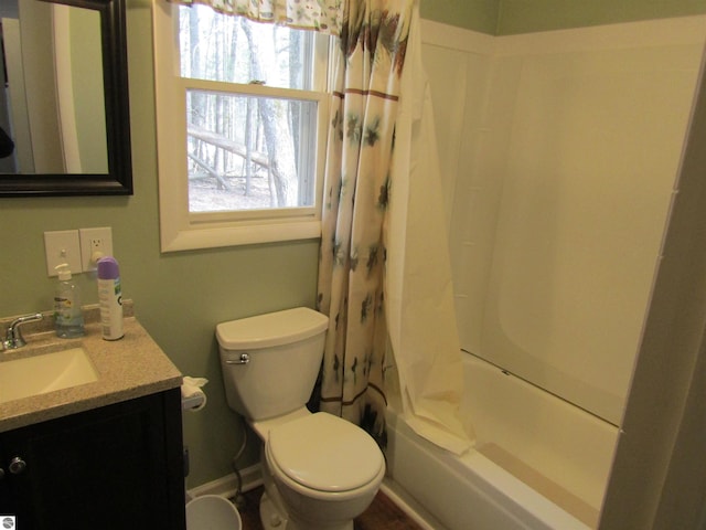 bathroom with toilet, vanity, and shower / bath combination with curtain