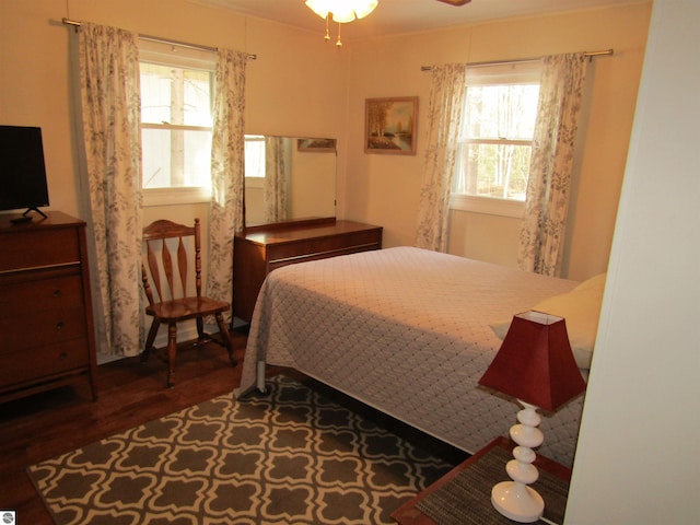 bedroom with wood finished floors