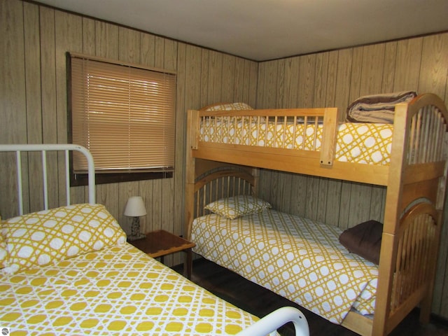 bedroom with wooden walls