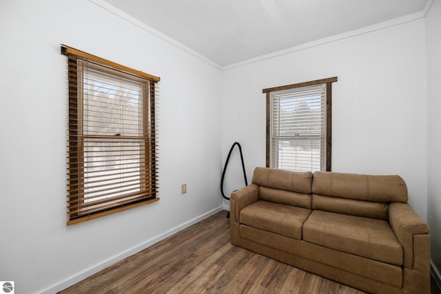 interior space with dark wood-type flooring, crown molding, and baseboards