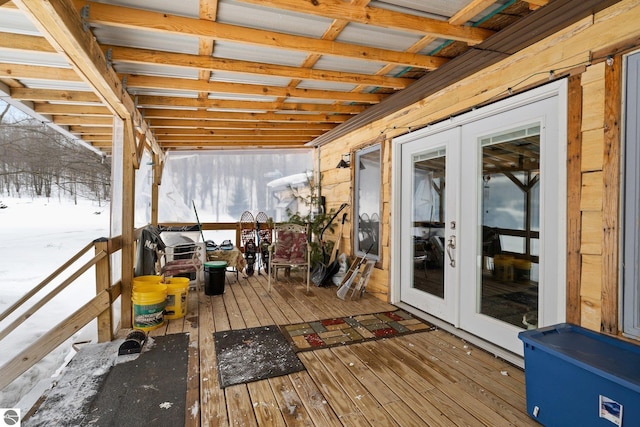 wooden deck featuring french doors