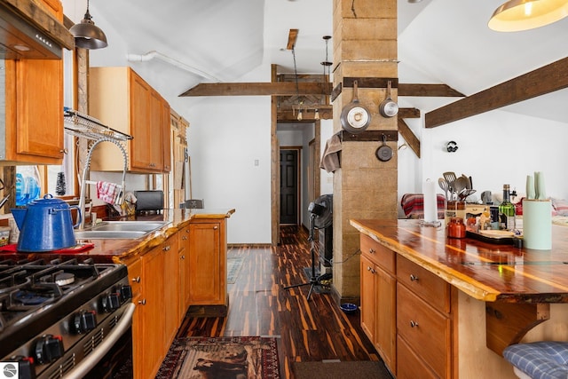 kitchen with lofted ceiling with beams, dark wood-style floors, brown cabinets, and wooden counters