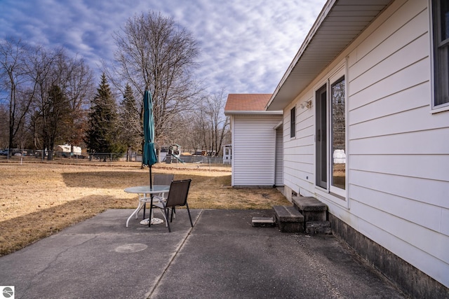 view of patio featuring fence